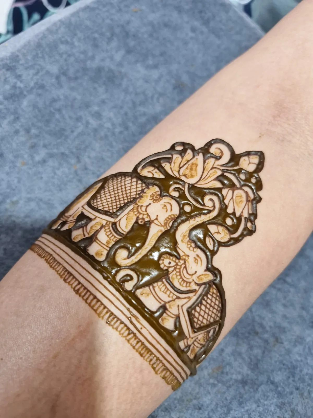 Forearm mhendi with facing elephants and floral motifs at Gopi Mahendi Art, Vastral Ahmedabad