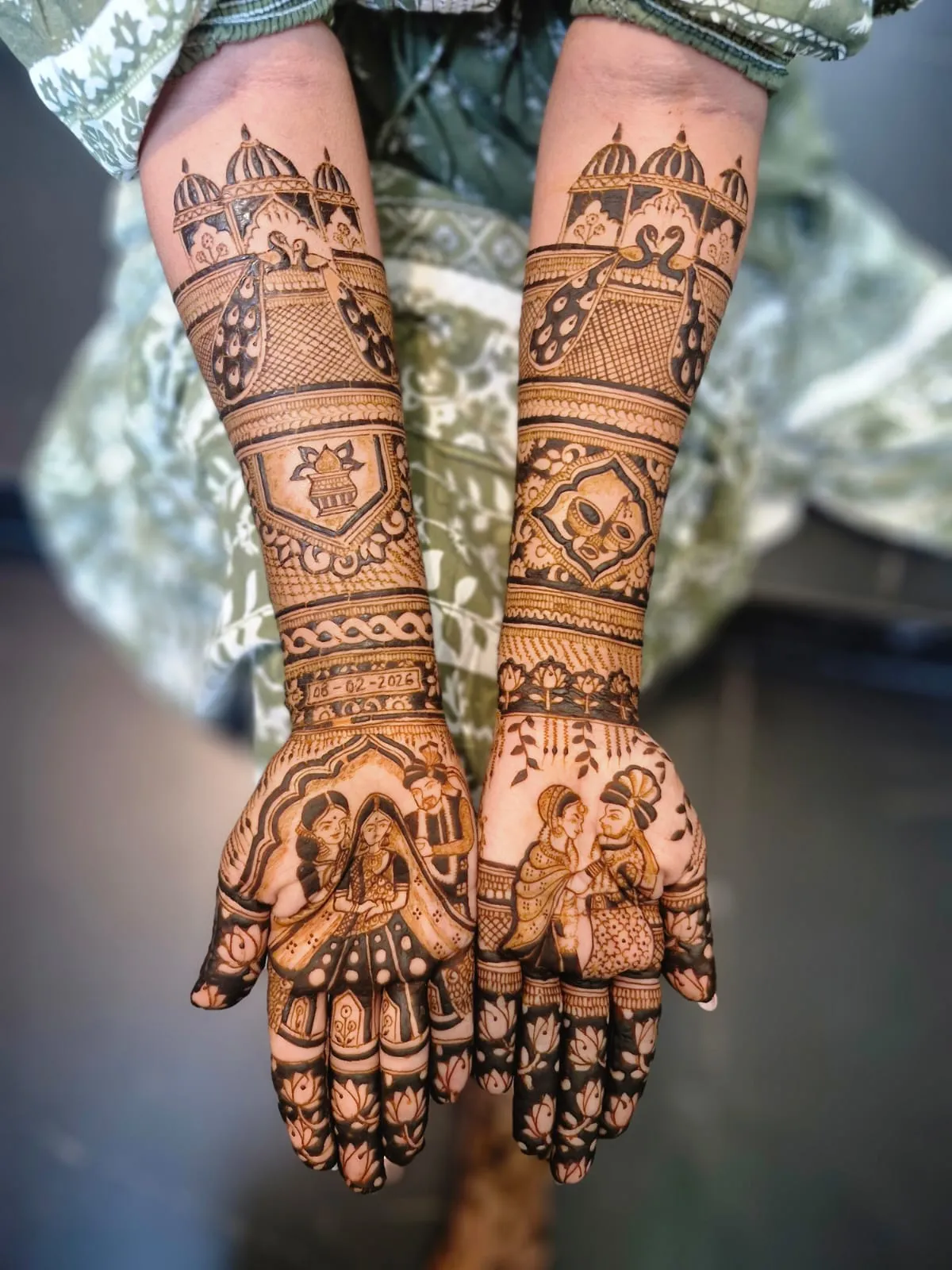 Full bridal mhendi with palace scenes and couple figures on palms, Ahmedabad
