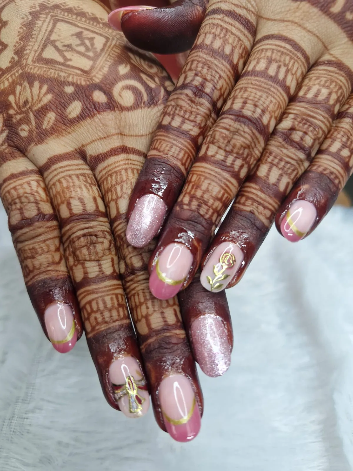 Pink and gold 3D nail art with bridal mhendi in Vastral Ahmedabad