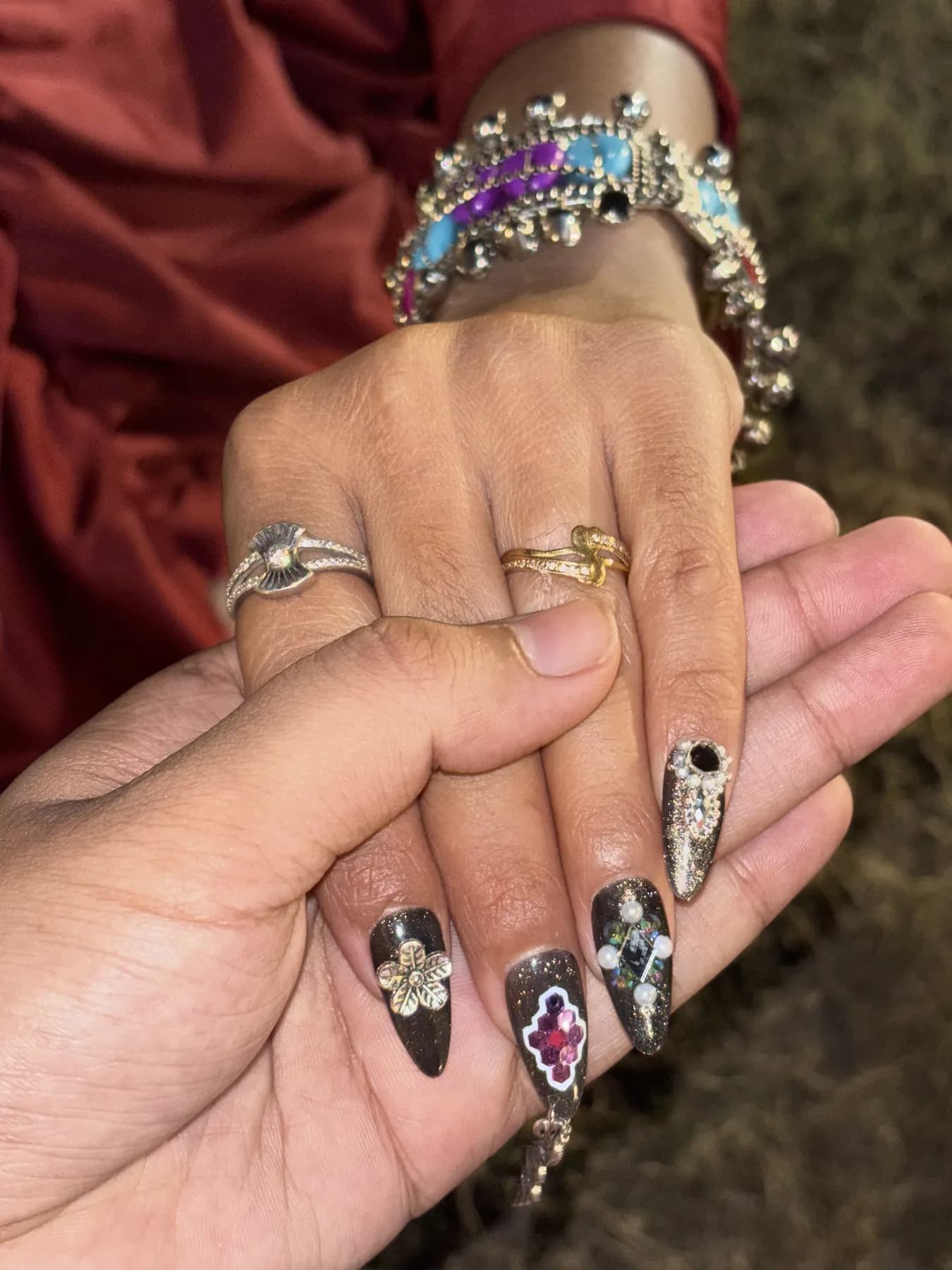 Black glitter nails with 3D charms and gems nail art Ahmedabad